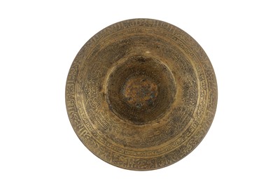 Lot 125 - AN ENGRAVED BRASS 'MAGIC' BOWL WITH THE PROPHET'S CENOTAPH AND MINBAR SYMBOLS