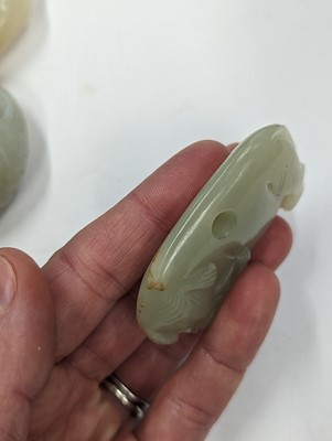 Lot 720 - A GROUP OF THREE CHINESE CELADON JADE CARVINGS