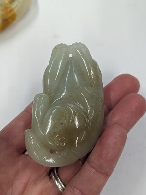 Lot 720 - A GROUP OF THREE CHINESE CELADON JADE CARVINGS