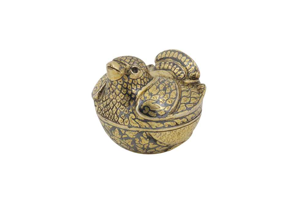 Lot 151 - An early 20th century Thai silver gilt niello lime box for the Cambodian market, Bangkok or Nakon Sri Thammarat circa 1930