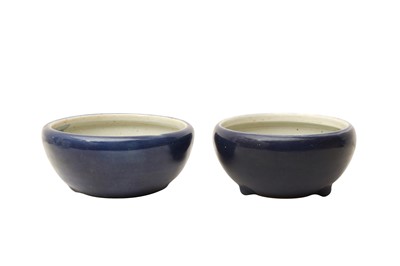 Lot 682 - A PAIR OF CHINESE MONOCHROME BLUE-GLAZED ALMS BOWLS