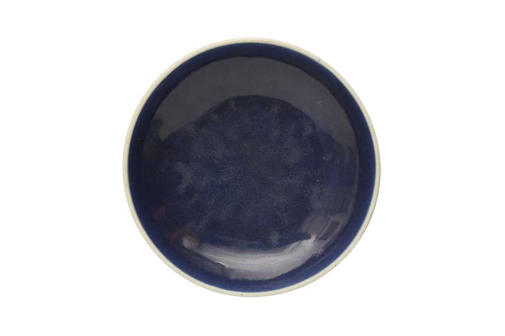 Lot 128 - A CHINESE MONOCHROME BLUE-GLAZED DISH