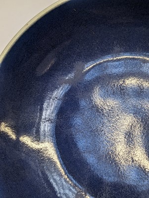 Lot 128 - A CHINESE MONOCHROME BLUE-GLAZED DISH