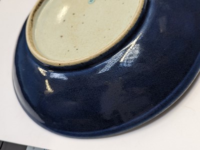 Lot 128 - A CHINESE MONOCHROME BLUE-GLAZED DISH