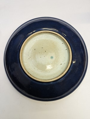 Lot 128 - A CHINESE MONOCHROME BLUE-GLAZED DISH