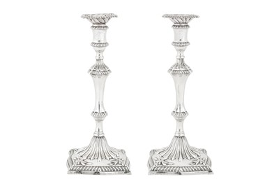 Lot 498 - A pair of George III sterling silver cast candlesticks, London 1776 by John Carter