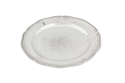Lot 473 - A George III sterling silver dinner plate, London 1767 by James and Sebastian Crespell