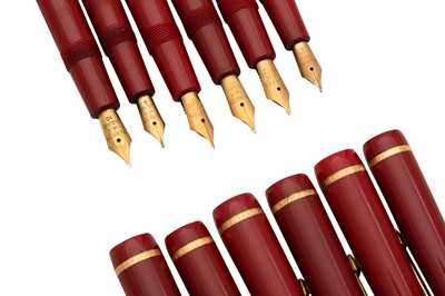 Lot 94 - A GROUP OF SIX RED PARKER FOUNTAIN PENS