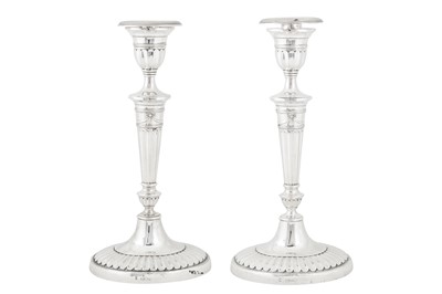 Lot 390 - A pair of Victorian sterling silver candlesticks, London 1899 by Holland, Aldwinckle and Slater