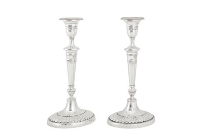 Lot 390 - A pair of Victorian sterling silver candlesticks, London 1899 by Holland, Aldwinckle and Slater