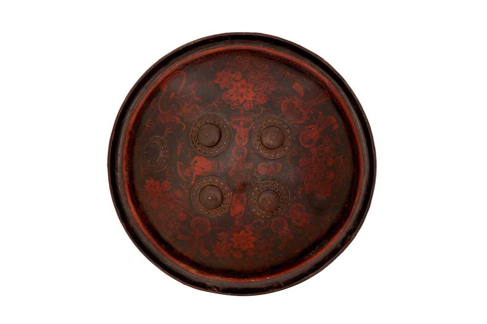 Lot 279 - A POLYCHROME-PAINTED AND LACQUERED RHINO HIDE SHIELD (DHAL) WITH HINDU DEITIES