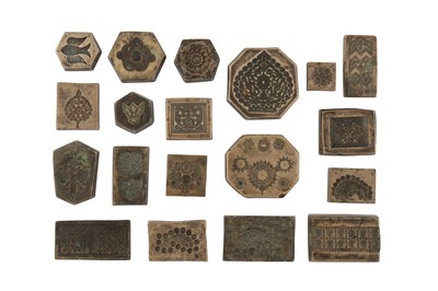 Lot 426 - NINETEEN BRASS DECORATIVE MOULDS FOR TOOLING LEATHER COVERS