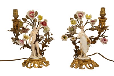 Lot 414 - A PAIR OF GERMAN ORMOLU MOUNTED PORCELAIN FIGURAL CANDLESTICKS