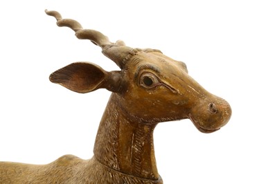 Lot 299 - AN INDIAN-CARVED WOODEN SCULPTURE OF A DEER