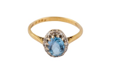 Lot 8 - A TOPAZ AND DIAMOND CLUSTER RING