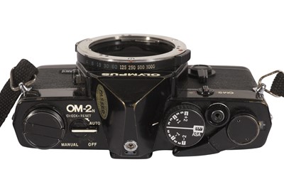 Lot 95 - An Olympus OM2N SLR Camera Outfit