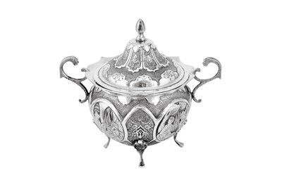 Lot 214 - A late 20th century Persian (Iranian) silver tea glass holder and sugar bowl set, Isfahan circa 1995 by Seyyed Hassan Jouzdani (b.1928, d.c. 2022)