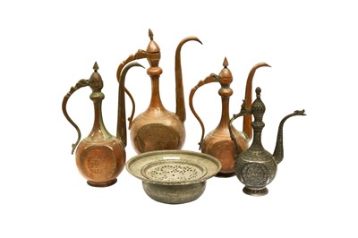 Lot 49 - FOUR ENGRAVED TINNED COPPER EWERS AND A BASIN