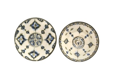 Lot 4 - A NEAR PAIR OF COBALT BLUE AND BLACK-PAINTED POTTERY BOWLS WITH ARABESQUE MOTIFS