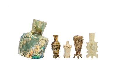 Lot 2 - FOUR SMALL EARLY ISLAMIC GLASS OINTMENT FLASKS AND A MISFIRED BOTTLE