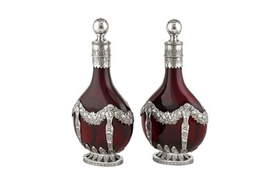 Lot 278 - A pair of late 19th century German 800 standard silver mounded ruby glass decanters, Kesselstadt circa 1890 by Karl Kurz