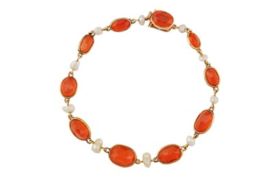 Lot 117 - A fire opal and pearl bracelet, circa 1905