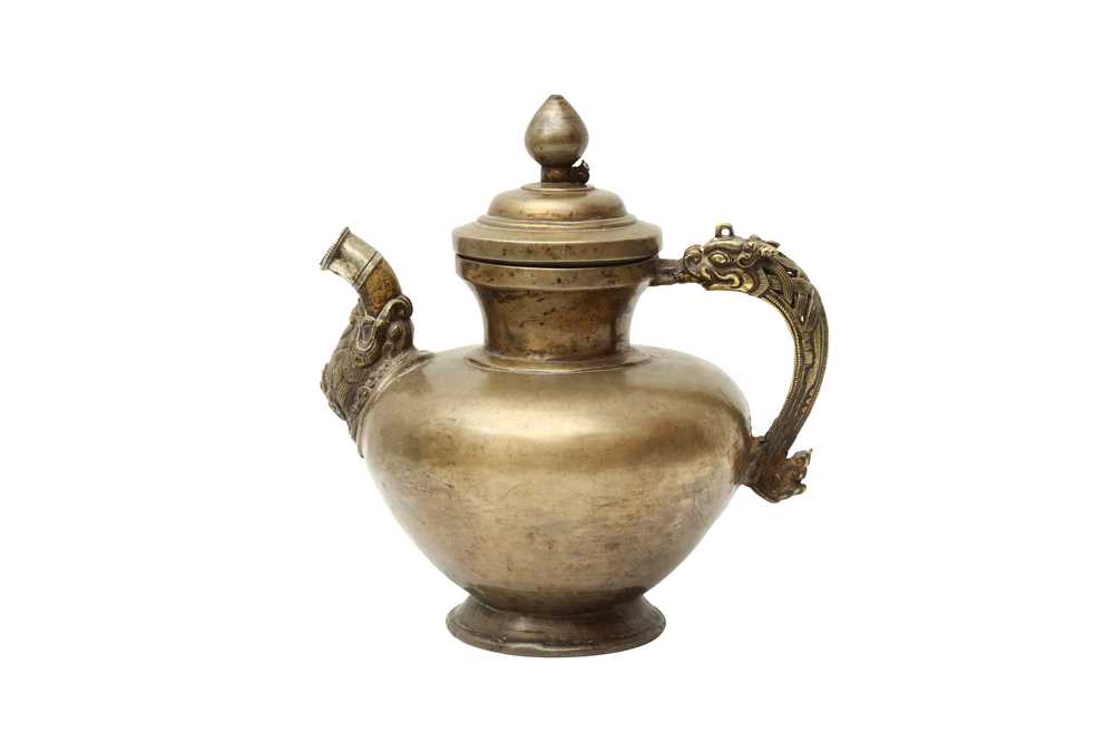 Lot 361 - A TIBETAN BRONZE EWER AND COVER