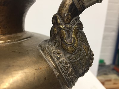 Lot 361 - A TIBETAN BRONZE EWER AND COVER