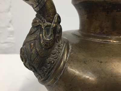 Lot 361 - A TIBETAN BRONZE EWER AND COVER