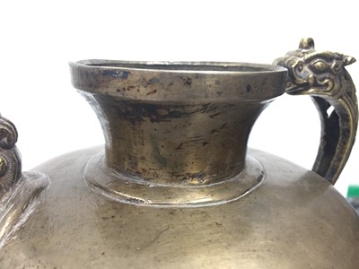 Lot 361 - A TIBETAN BRONZE EWER AND COVER