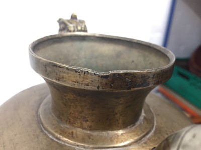 Lot 361 - A TIBETAN BRONZE EWER AND COVER