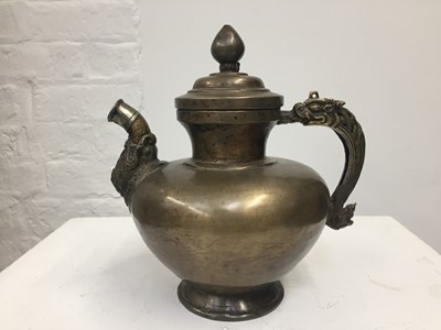 Lot 361 - A TIBETAN BRONZE EWER AND COVER