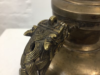 Lot 361 - A TIBETAN BRONZE EWER AND COVER