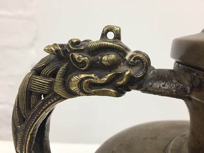 Lot 361 - A TIBETAN BRONZE EWER AND COVER