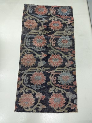 Lot 82 - A TIBETAN WOOL 'LOTUS' SLEEPING RUG, KHADEN