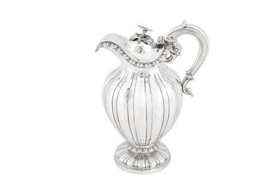 Lot 411 - A William IV sterling silver claret jug or ewer, London 1830 by messrs Barnard