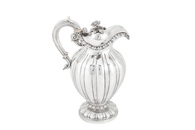 Lot 411 - A William IV sterling silver claret jug or ewer, London 1830 by messrs Barnard