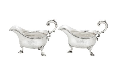 Lot 516 - A pair of George II sterling silver sauce boats, London 1759 by William Skeen (first reg. 4th Dec 1755)