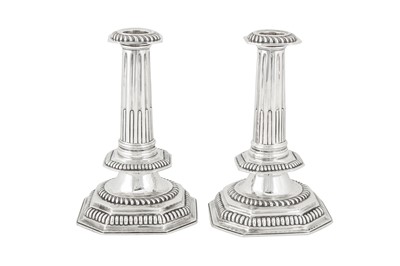 Lot 401 - A pair of Victorian sterling silver candlesticks, London 1875 by John Henry Williamson