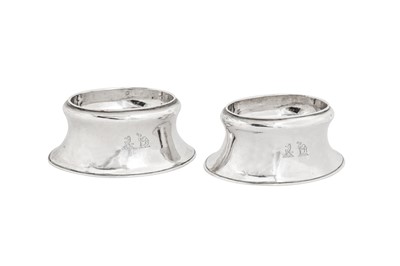 Lot 508 - A pair of George II sterling silver trencher salts, London 1732 by Edward Wood (first reg. 18th Aug 1722)