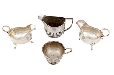 Lot 1185 - A PAIR OF VICTORIAN STERLING SILVER SAUCEBOATS, LONDON 1885 BY ALDWINCKLE AND SLATER