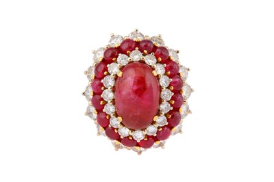 Lot 35 - A CABOCHON RUBY AND DIAMOND CLUSTER RING