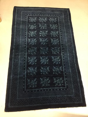 Lot 86 - A CHINESE BLUE-GROUND 'FLOWERS' CARPET