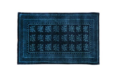 Lot 86 - A CHINESE BLUE-GROUND 'FLOWERS' CARPET