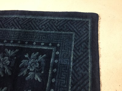 Lot 86 - A CHINESE BLUE-GROUND 'FLOWERS' CARPET