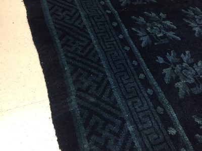 Lot 86 - A CHINESE BLUE-GROUND 'FLOWERS' CARPET