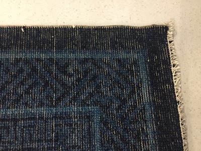 Lot 86 - A CHINESE BLUE-GROUND 'FLOWERS' CARPET