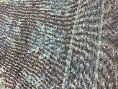 Lot 86 - A CHINESE BLUE-GROUND 'FLOWERS' CARPET