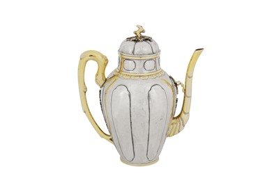 Lot 538 - A rare and interesting early to mid-18th century Chinese parcel gilt silver wine pot, circa 1720-50