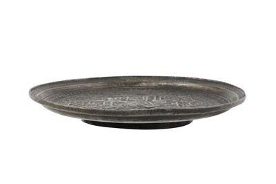 Lot 266 - A DECCANI ENGRAVED TINNED COPPER SAUCER WITH NAD-E 'ALI SHI'A PRAYER